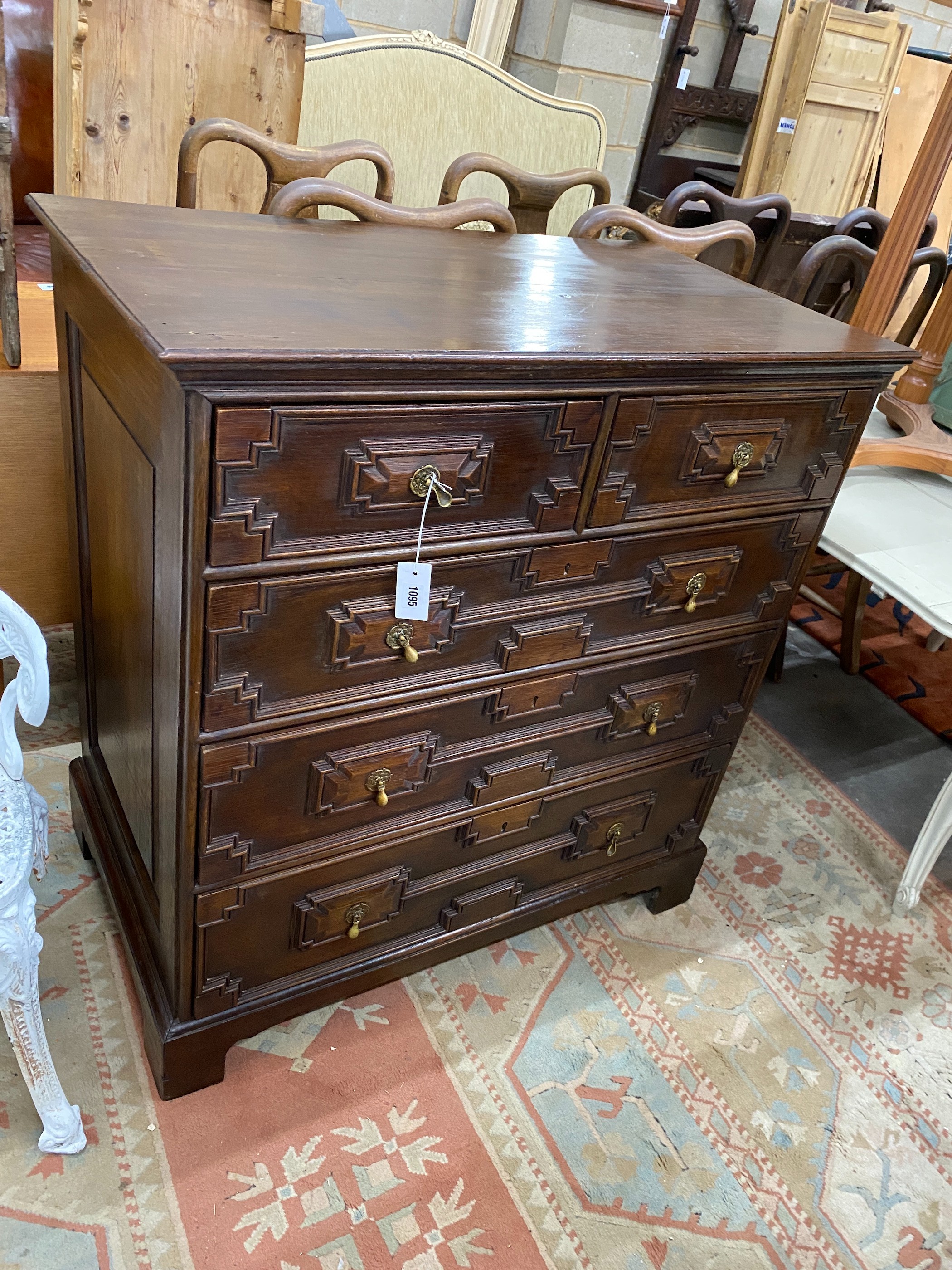 A 19th century oak panelled chest of drawers with chestnut lining, width 97cm, depth 55cm, height 103cm